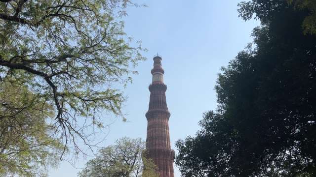 Majestic Qutub Minar Towering Above Delhi's Historic Landscape