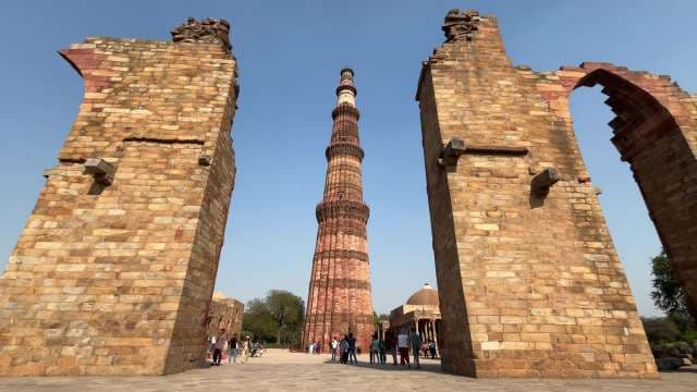 Majestic Qutb Minar Soars Above Ancient Ruins in Delhi