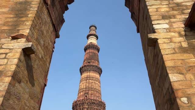Majestic View of Qutub Minar Against Clear Blue Sky