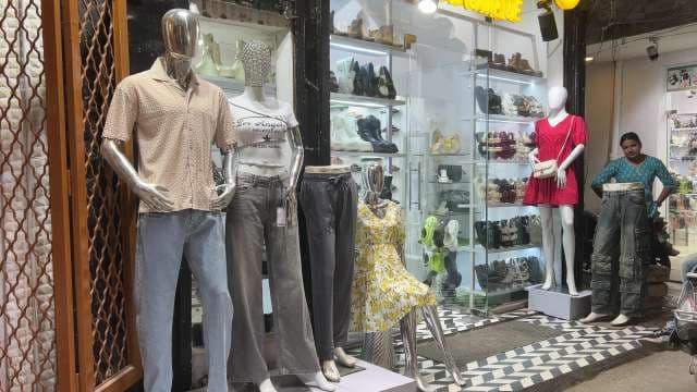 Trendy Clothing Store Mannequin Display on City Street
