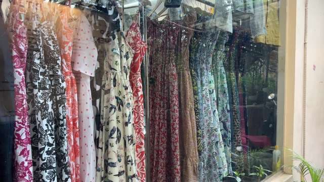 Colorful Summer Dresses Displayed in Boutique Window