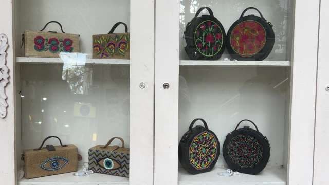 Colorful Embroidered Handbags Displayed in Boutique Window