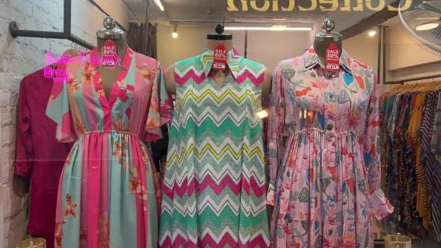 Trendy Summer Dresses on Mannequins in Fashion Boutique Window