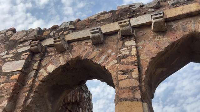 Ancient Stone Archways Against a Blue Sky