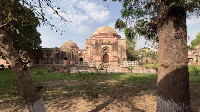 Echoes of Faith: Historic Mosque Amid Lush Gardens
