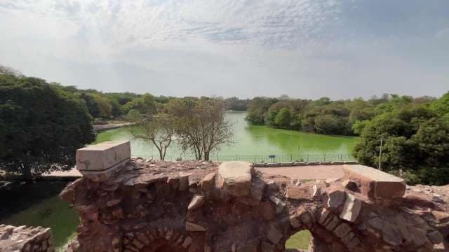 Historic Fort Wall Overlooking Lush Lake at Hauz Khas