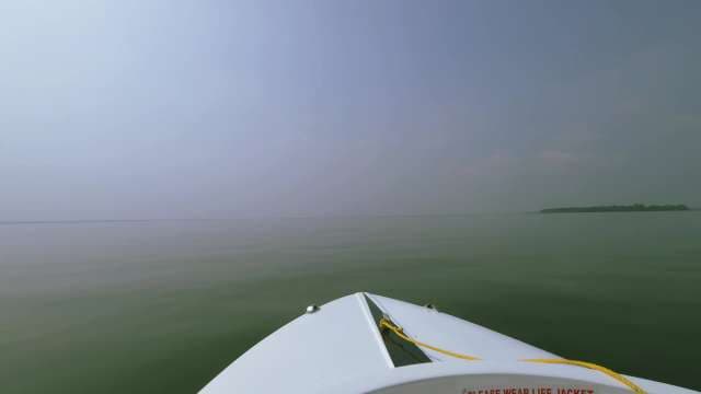 Scenic Boat Ride Across Calm Lake Waters