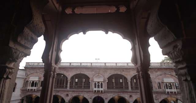Exploring Majestic Indian Palace Arches and Courtyards
