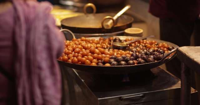 Street Vendor Prepares Fresh Gulab Jamun in Sarafa Market, Indore, India