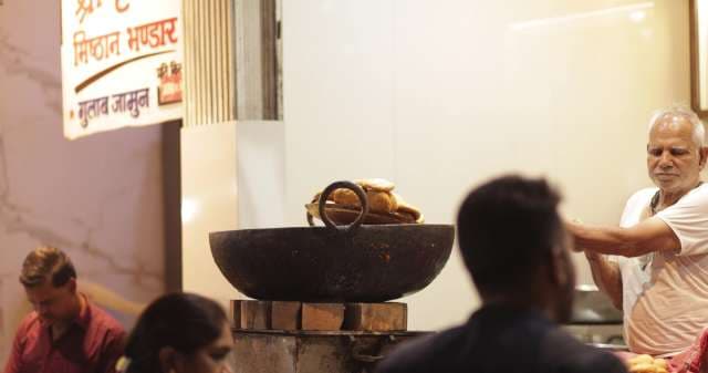 Street Food Vendor Cooking Traditional Indian Snacks in Indore