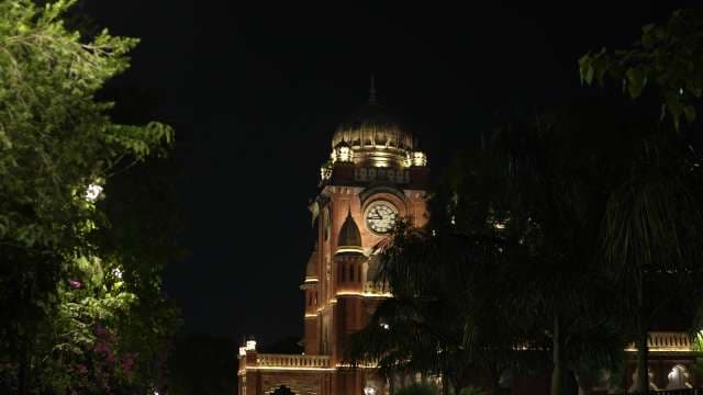 Illuminated Town Hall Clock Tower at Night in Indore