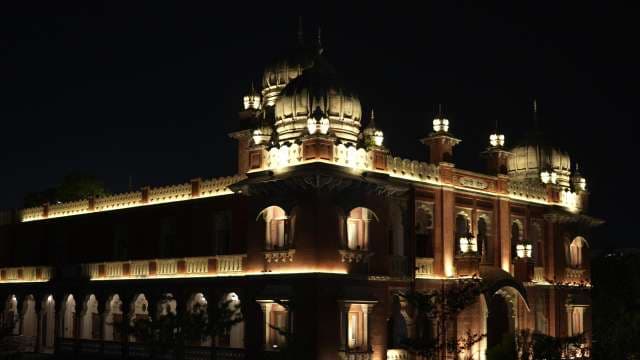 Illuminated Historic Town Hall at Night Showcasing Stunning Architecture