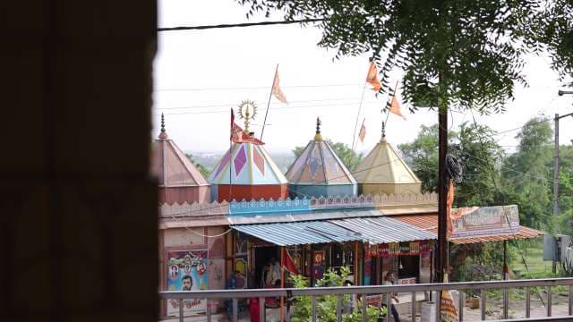 Colorful Hindu Temple with Traditional Spires in Rural India