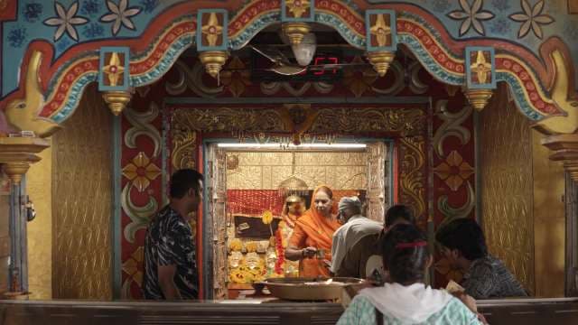 Devotees Receiving Blessings at Vibrant Indian Temple