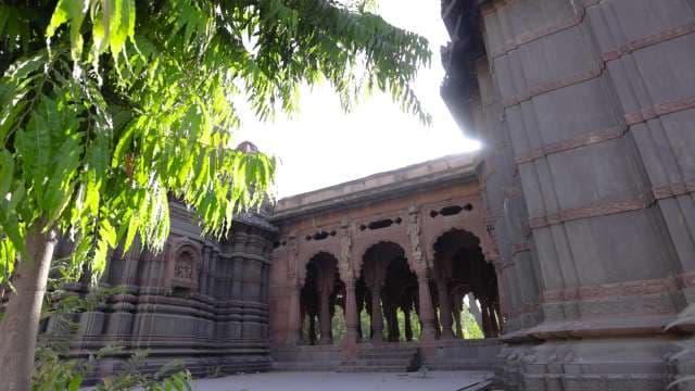 Historic Indian Temple with Ornate Arches and Stonework