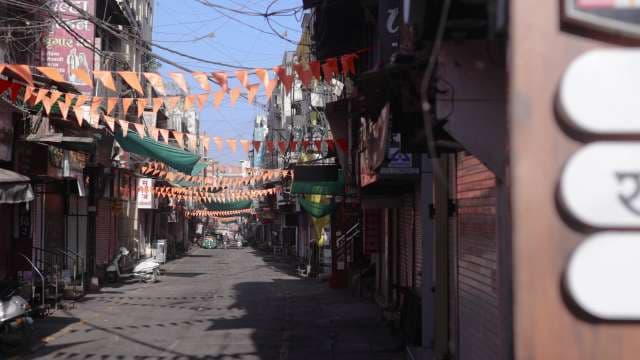 Empty Market Street Decorated With Orange Bunting Flags