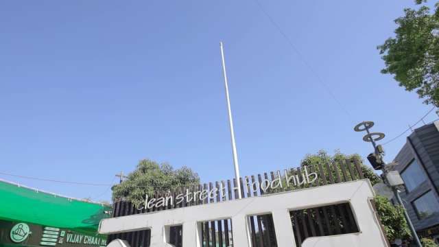 Clean Street Food Hub Entrance Under Clear Blue Sky