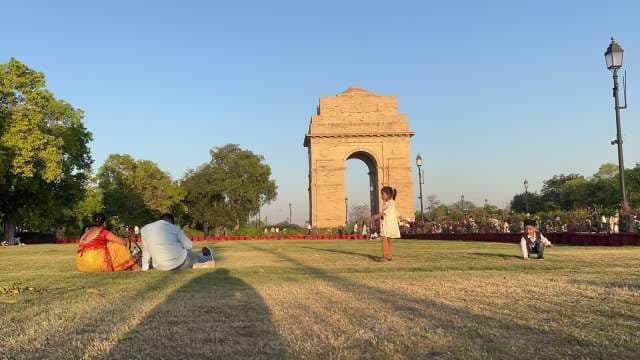 Families Relaxing at Iconic India Gate Monument in Delhi
