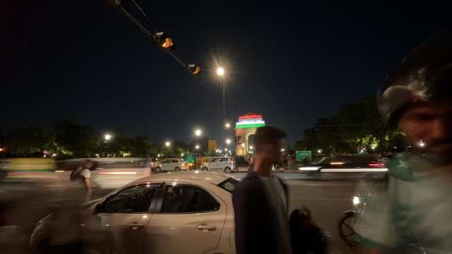 Night Traffic and Crowds at Illuminated India Gate Delhi