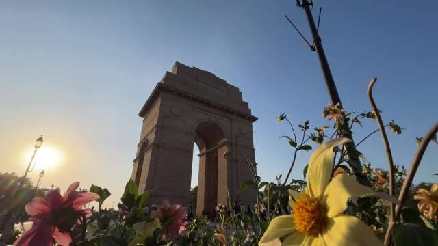 India Gate at Sunset with Vibrant Flower Blooms