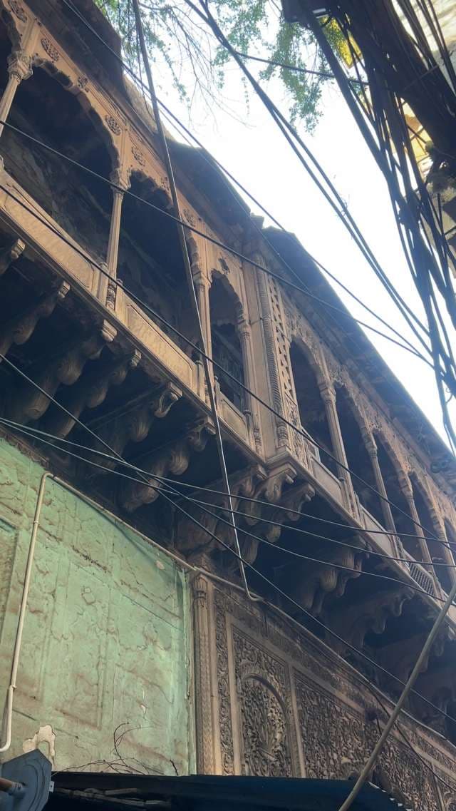 Exploring Ornate Wooden Haveli Balcony in Old Delhi