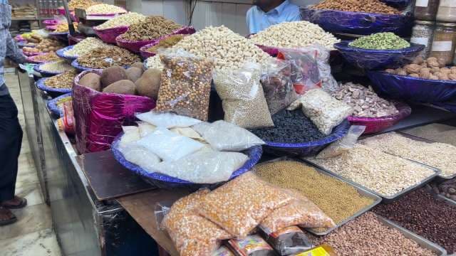 Colorful Market Stall Displaying Assorted Nuts and Dry Fruits