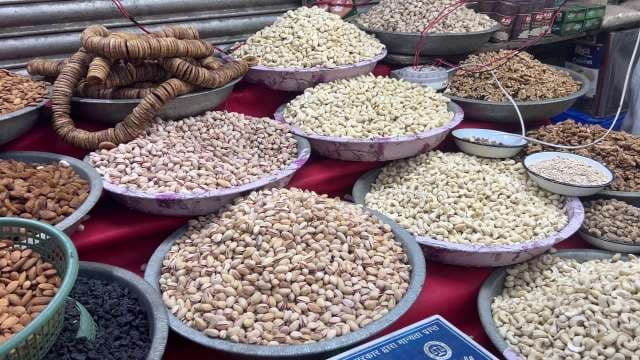 Vibrant Market Stall Displaying Assorted Dry Fruits and Nuts