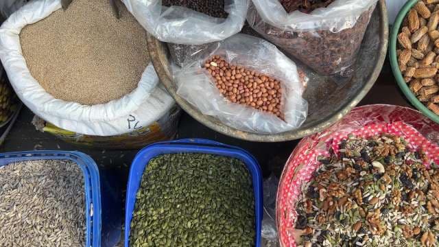 Variety of Nuts and Seeds Displayed at Local Market