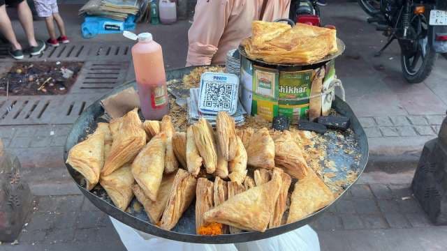 Street Vendor Selling Freshly Baked Indian Patties in Delhi