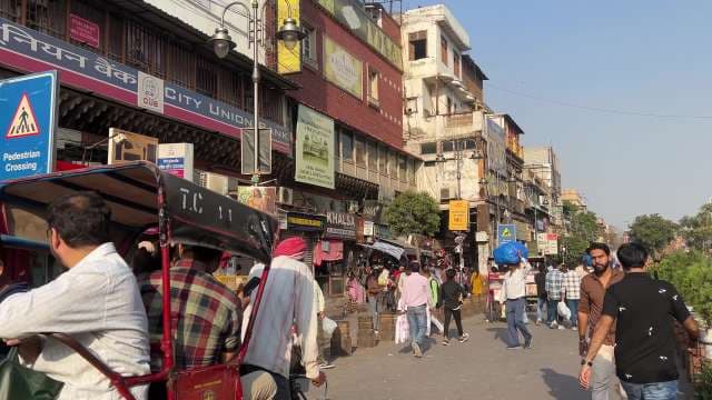 Bustling Street Market Scene in Old Delhi, India