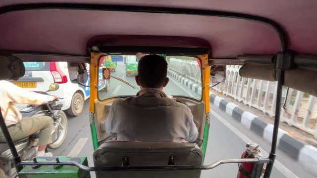 Auto Rickshaw Ride Through Busy Streets of Delhi