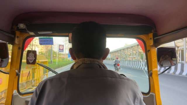 Auto Rickshaw Ride Through Busy Indian City Streets