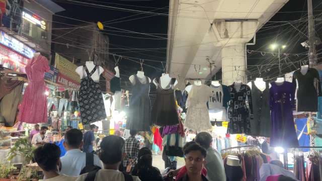 Bustling Night Market with Clothing Stalls in India