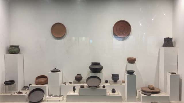 Ancient Pottery Artifacts Displayed in Museum Exhibit Case