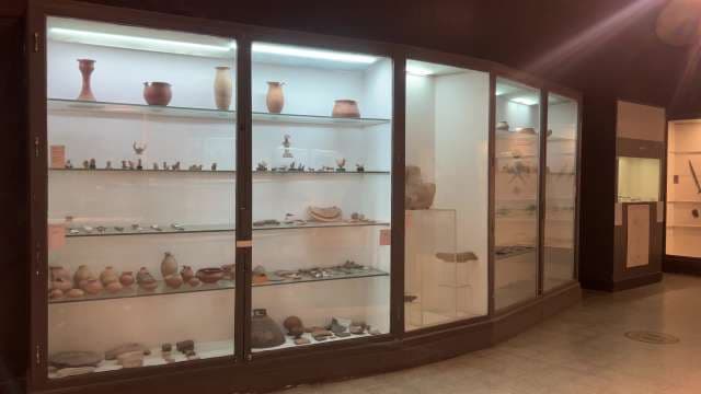 Ancient Artifacts Displayed in Museum Exhibit Cases