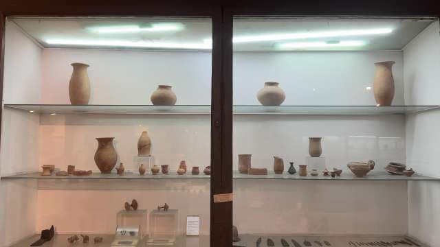 Ancient Pottery Artifacts Displayed in Museum Showcase