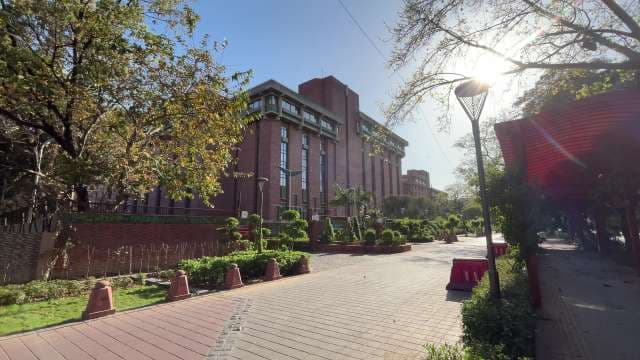 Modern Red Brick Building in Sunlit Urban Setting