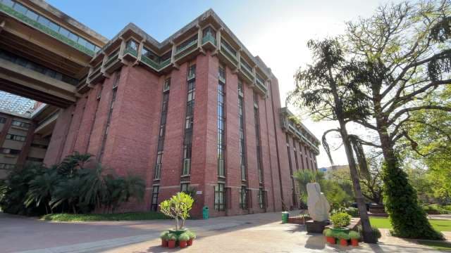 Modern Red Brick Building with Vertical Windows in Urban Campus