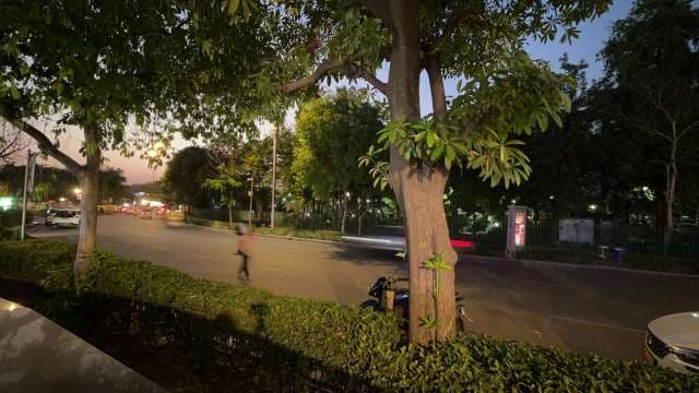 Evening Traffic and Pedestrian on Urban Street