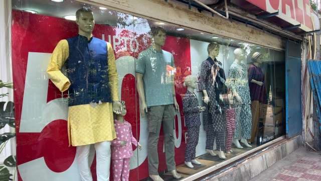 Vibrant Clothing Store Window Display With Mannequins