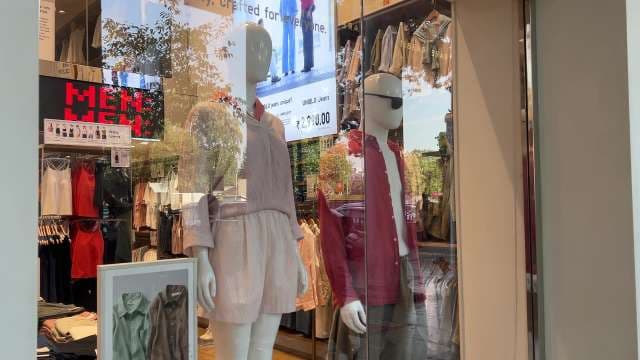 Trendy Clothing Store Window Display With Mannequins