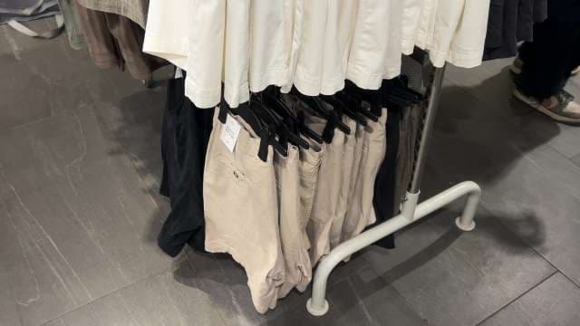 Beige and Black Casual Shorts Display in Clothing Store