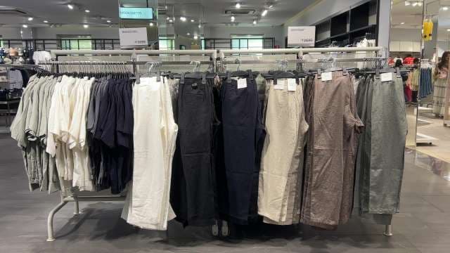 Trendy Linen Pants and Shirts Display in Fashion Store