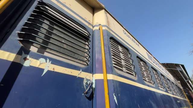Classic Indian Railways Coach Under Clear Blue Sky