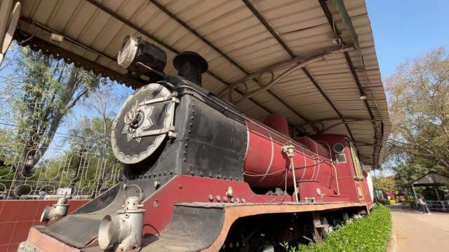 Historic Red Steam Locomotive on Display at Railway Museum