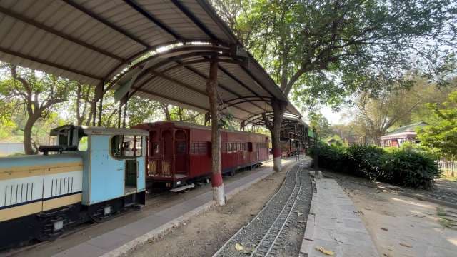 Miniature Train Waiting at Covered Station Platform