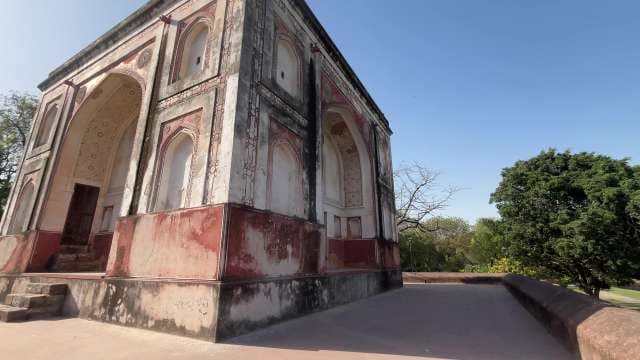 Ancient Mughal Monument Amidst Lush Greenery in Delhi