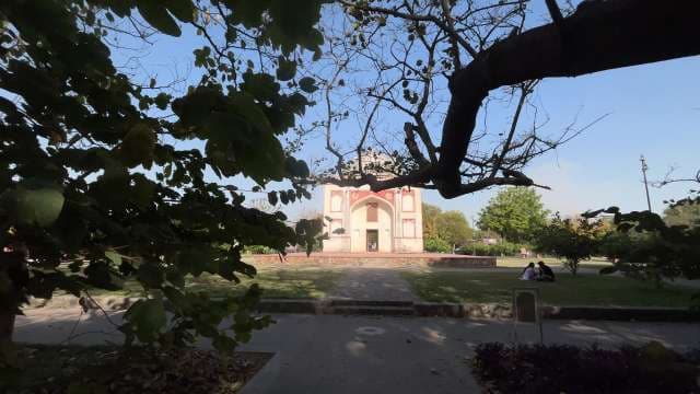Historic Tomb Framed by Lush Garden in Delhi