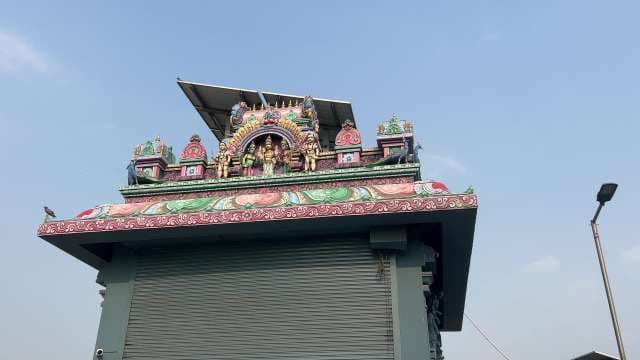 Colorful South Indian Temple Gopuram Under Blue Sky