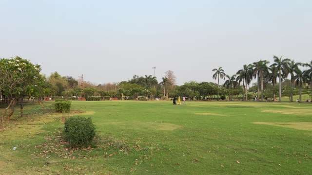 Tranquil Kamla Nehru Park With Palm Trees and Visitors